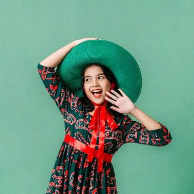 Asian girl wearing large green hat