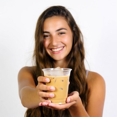 Young woman holding iced coffee
