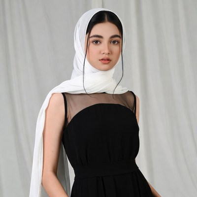 Asian woman in white hijab black dress