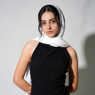 Woman in white hijab black dress