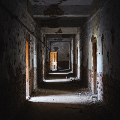 Abandoned Hallway with Open Doors