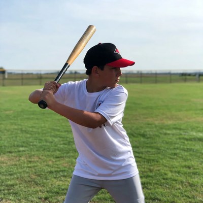 Boy swinging baseball bat
