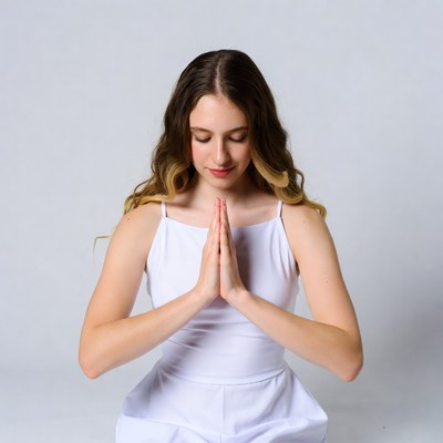 Girl praying with hands together
