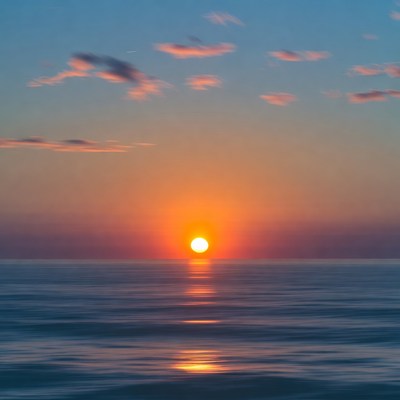 Sunset over calm ocean
