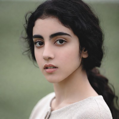 Young woman with curly black hair