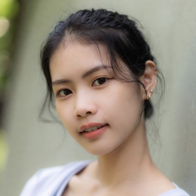 Young Asian woman with braided hair