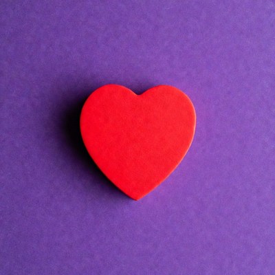 Red heart on purple background