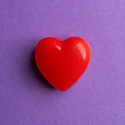Red heart on purple background