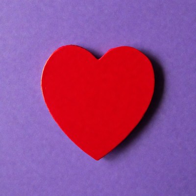 Red heart on purple background