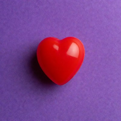 Red heart on purple background