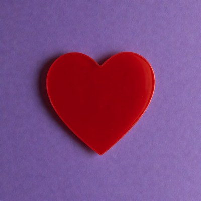 Red heart on purple background
