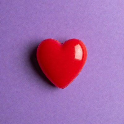 Red heart on purple background