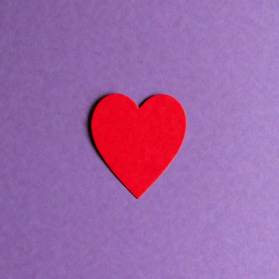 Red heart on purple background