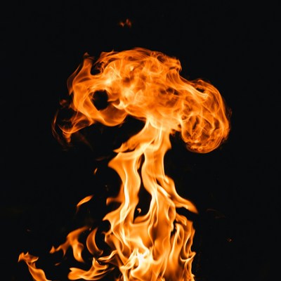 Fiery flame burst on black