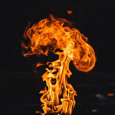 Fiery explosion flames on black background