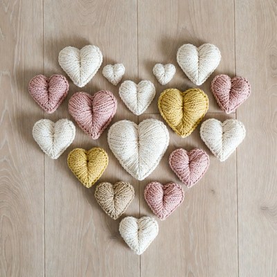 Crocheted hearts on wooden floor