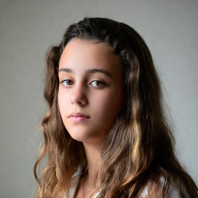 Teen girl with wavy brown hair