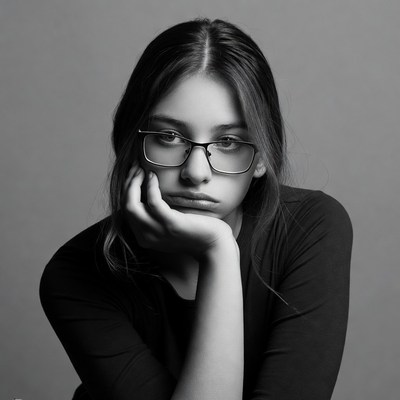 Young woman resting chin on hand