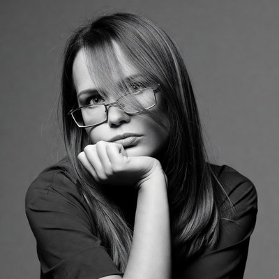 Woman resting chin on hand