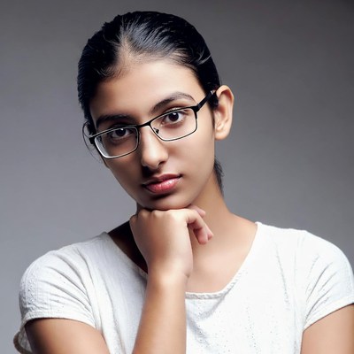 Indian girl with glasses chin resting