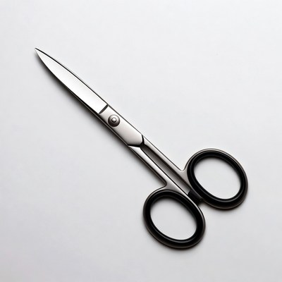 Silver scissors on white background