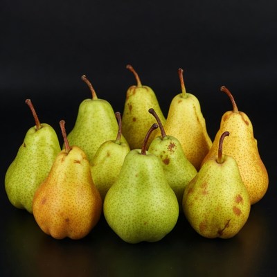 Fresh green pears on black background
