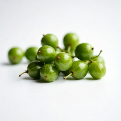 Fresh green gooseberries on white background
