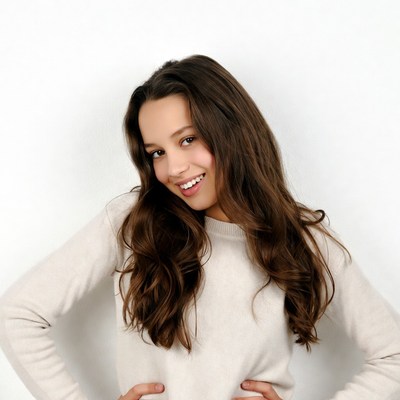 Smiling girl with hands on hips