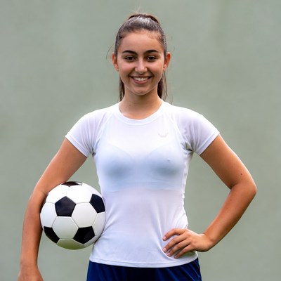 Girl holding soccer ball