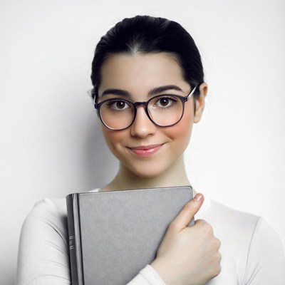 Young woman holding book glasses