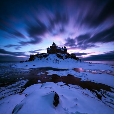 Castle on snowy island at twilight