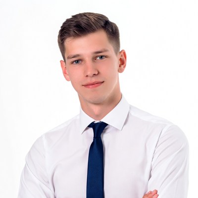 Young man in white shirt and blue tie