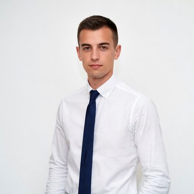 Young man in white shirt and navy tie