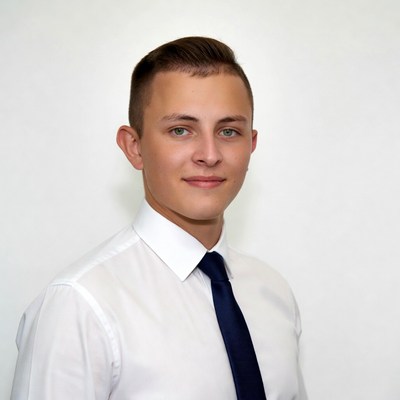 Young man in white shirt and blue tie