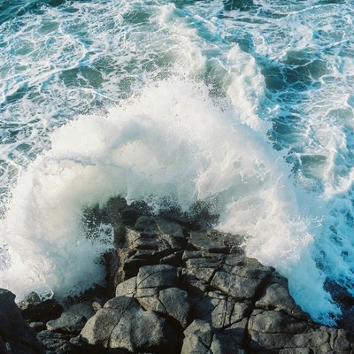Ocean Wave Crashing on Rocks