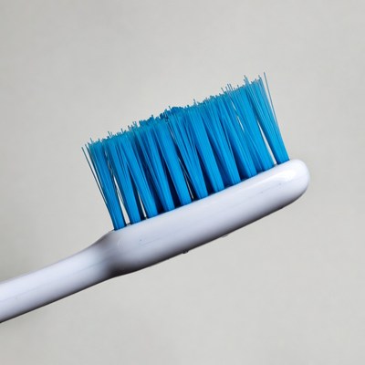 Blue toothbrush on white background
