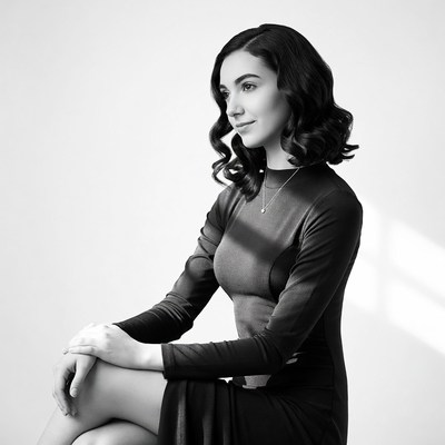 Woman in black dress profile view