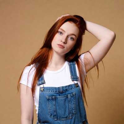 Redhead woman in denim overalls