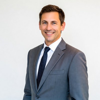 Smiling man in gray suit