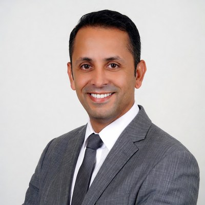 Smiling man in gray suit