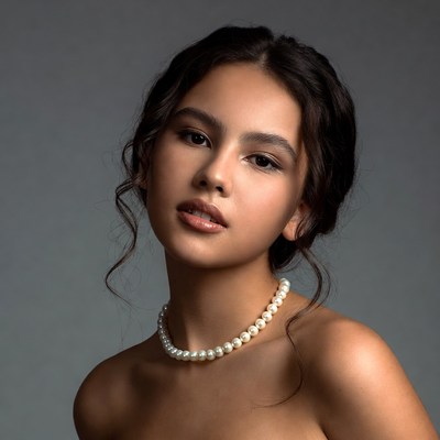 Asian woman with pearl necklace