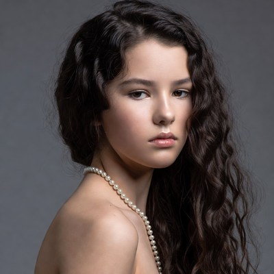 Young woman with pearl necklace