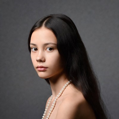 Asian girl with pearl necklace
