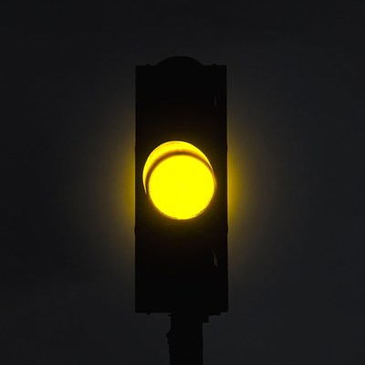 Yellow traffic light glowing