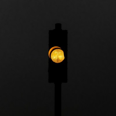 Yellow Traffic Light at Night