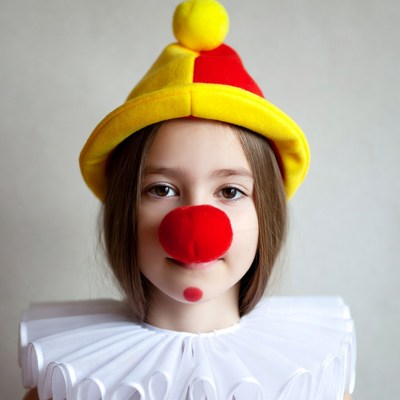 Girl in yellow red clown costume