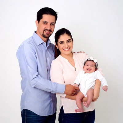 Family holding smiling baby