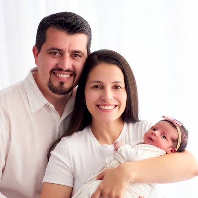 Family holding newborn baby