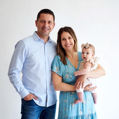 Family with baby on white background