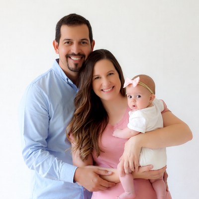 Family holding smiling baby